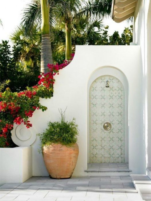 White entrance with flower pots
